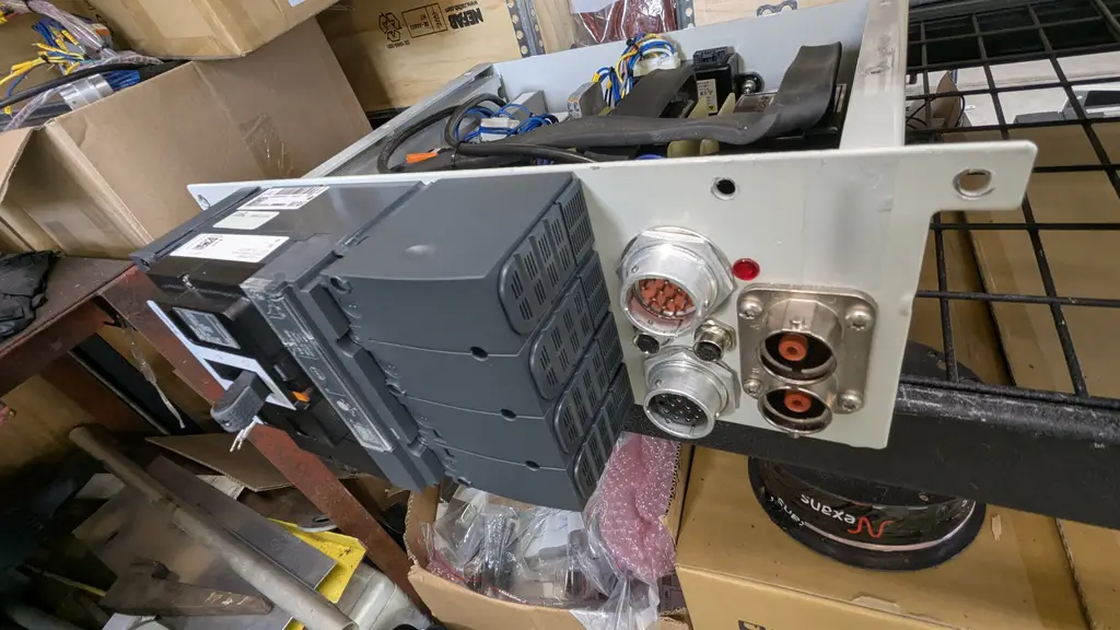Battery switch module on a bench, connectors visible