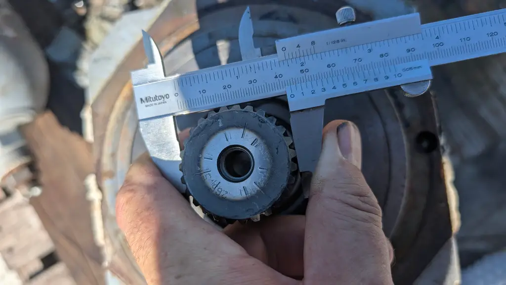 Caliper measuring a small replacement part